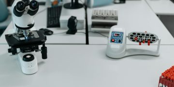 A well-equipped laboratory with a microscope and vials ready for analysis.