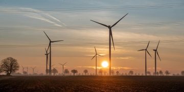 Beautiful sunset scene with wind turbines in Koningsbosch, Limburg, Netherlands.
