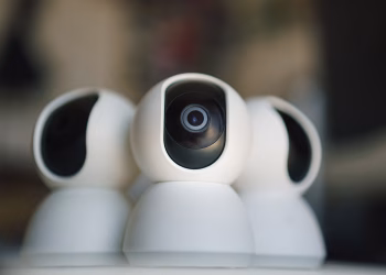 Close-up of sleek security cameras ensuring safety and privacy in indoor settings.