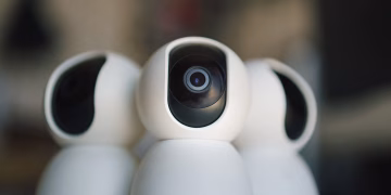 Close-up of sleek security cameras ensuring safety and privacy in indoor settings.