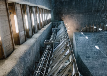 Metal constructions and LED lamps in underground hall of Salina Turda salt mine in Romania