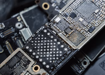 Detailed macro shot of electronic microchip components on a circuit board.