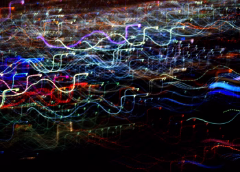 A captivating abstract image with colorful light trails in dynamic motion.