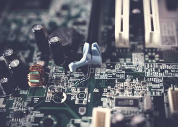 Detailed view of components on a computer motherboard, showcasing technology and circuitry.