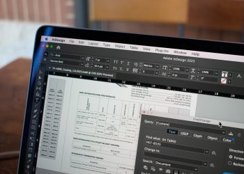 a close up of a computer screen with a table in the background