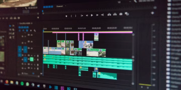 Close-up of a video editing timeline interface on a computer screen, showcasing professional software in action.