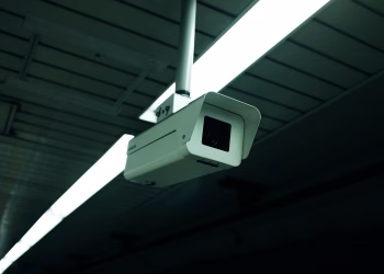 Close-up of an indoor ceiling-mounted security camera for surveillance applications.
