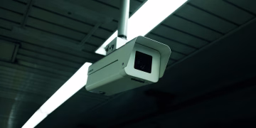 Close-up of an indoor ceiling-mounted security camera for surveillance applications.