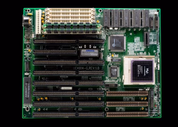 A close-up of a vintage motherboard highlighting microchips and electronic components.
