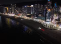 Stunning night view of Busan's illuminated cityscape along the coastline.