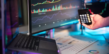 A vibrant setup showcasing financial analytics on screens, ideal for fintech themes.