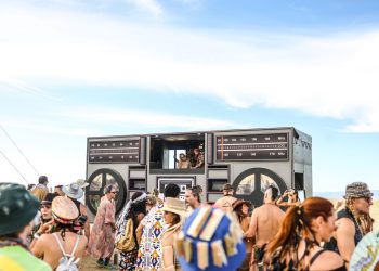 Lively outdoor music festival in Cape Town with a large crowd and unique decor.