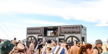 Lively outdoor music festival in Cape Town with a large crowd and unique decor.