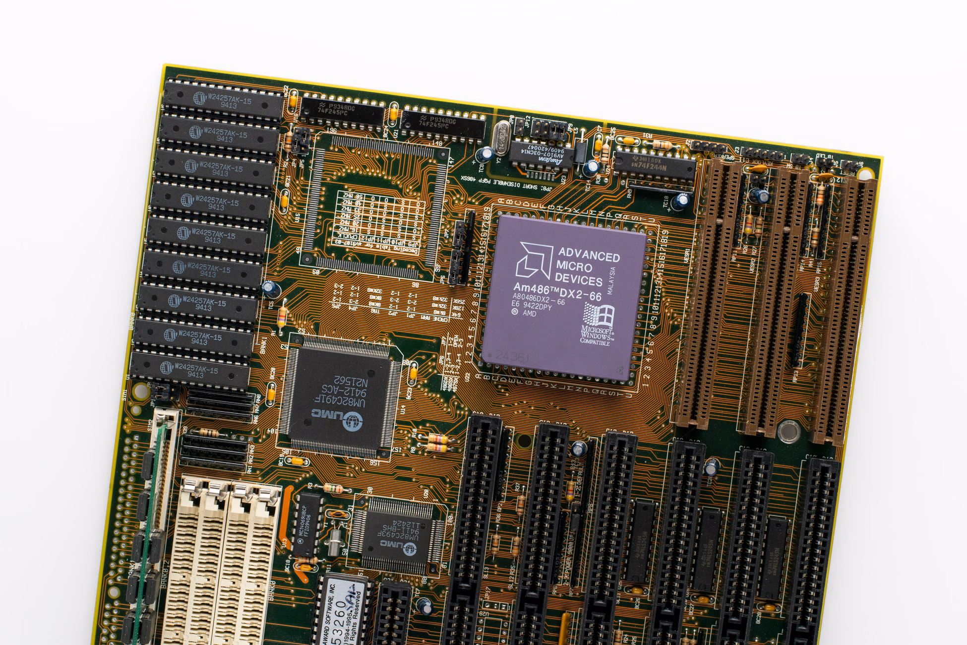 Detailed view of a vintage computer motherboard featuring an AMD processor and electronic components.
