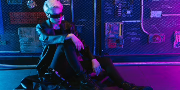 Cyberpunk portrait featuring a person in a futuristic outfit with neon lighting.