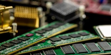 Detailed view of RAM sticks and microprocessors on a motherboard.