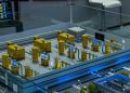 Detailed industrial model display showcasing machinery and systems indoors, emphasizing technology and design.