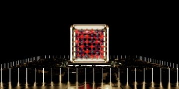 Abstract representation of a futuristic digital processor with glowing elements.