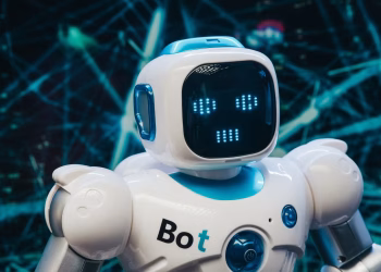 Close-up of a futuristic humanoid robot with a digital face display, representing modern technology.