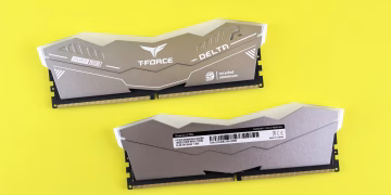 T-Force Delta RGB DDR5 memory modules on vibrant yellow surface.