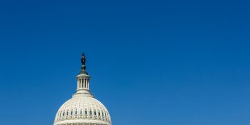 Stunning view of the US Capitol Dome in Washington, DC, with clear blue sky.