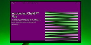 Close-up of a monitor displaying ChatGPT Plus introduction on a green background.