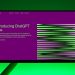 Close-up of a monitor displaying ChatGPT Plus introduction on a green background.