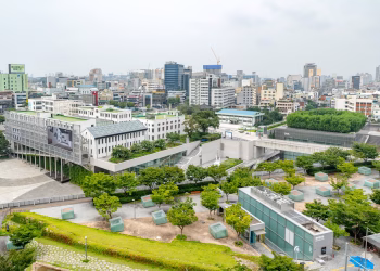 Aerial view of Gwangju cityscape showcasing modern architecture and green spaces.
