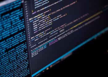 Close-up of a computer screen displaying HTML, CSS, and JavaScript code