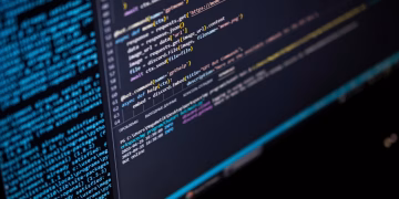 Close-up of a computer screen displaying HTML, CSS, and JavaScript code