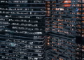 Close-up view of modern office buildings in Moscow, showcasing urban architecture at night.