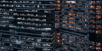 Close-up view of modern office buildings in Moscow, showcasing urban architecture at night.