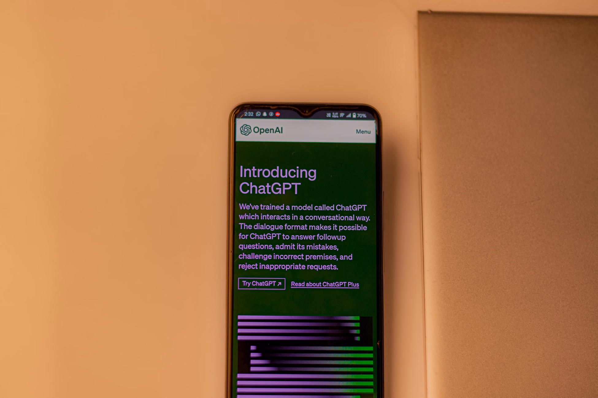 A smartphone showing the ChatGPT interface, emphasizing technology and AI indoors.