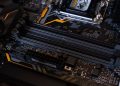 Detailed view of a computer motherboard showcasing RAM slots and electronic components.