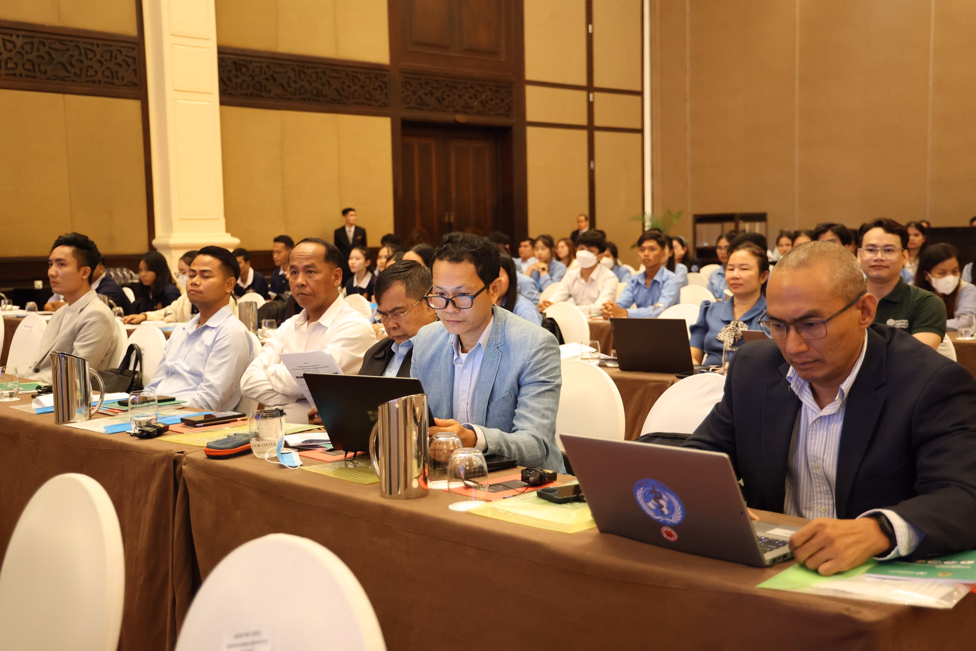 Participants attend a business conference in Phnom Penh, focusing on innovations and networking.