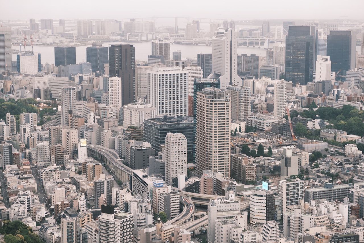 High-angle view of a dense, modern cityscape.