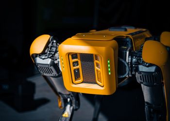 a close up of a robot that is yellow