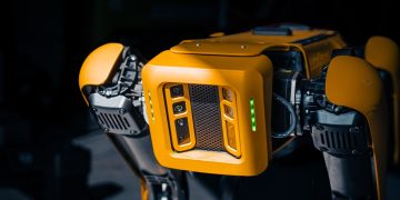 a close up of a robot that is yellow
