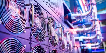 Close-up of server cooling fans in a vibrant data center.