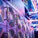Close-up of server cooling fans in a vibrant data center.