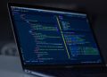 turned-on MacBook Pro wit programming codes display