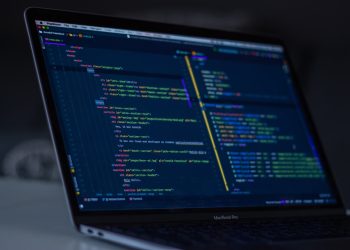 turned-on MacBook Pro wit programming codes display