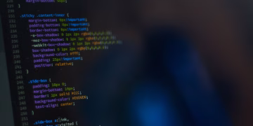 Close-up of CSS code displayed on a computer monitor, showcasing web development.