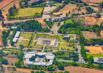 A stunning aerial view of landscaped architecture in Nandi Hills, Karnataka, India. Lush greenery surrounds modern structures.