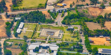 A stunning aerial view of landscaped architecture in Nandi Hills, Karnataka, India. Lush greenery surrounds modern structures.