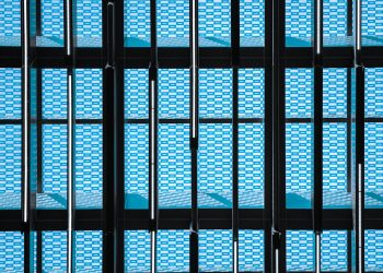 a building that has a bunch of blue squares on it