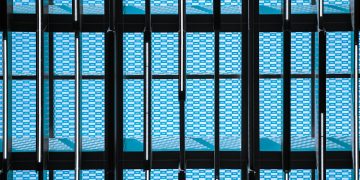 a building that has a bunch of blue squares on it