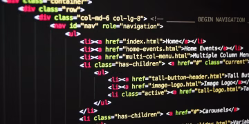 Close-up of vibrant HTML code displayed on a computer screen, showcasing web development and programming.