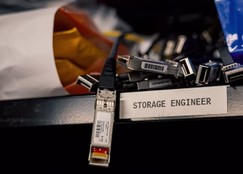 Low angle of various connectors and USB cables placed on shelf with storage engineer inscription