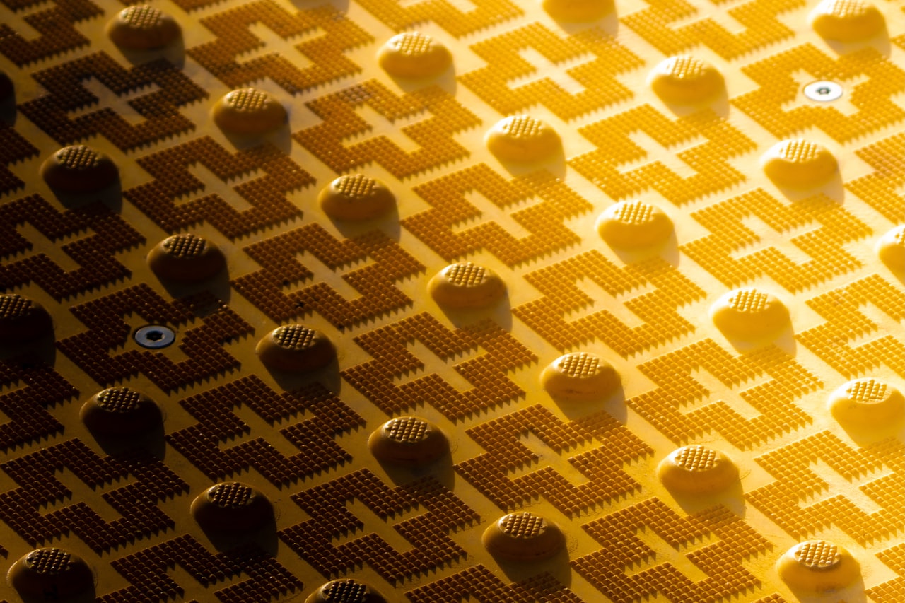 Abstract golden pattern with raised circular elements